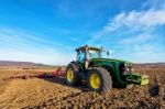 Varna, Bulgaria - March 5, 2017 Ploughing A Field With John Deer Stock Photo