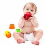 Cute Infant Boy With Apple Stock Photo