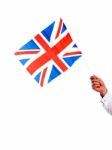 Male Hand Holding UK Flag Stock Photo