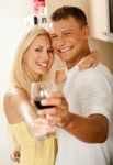 Happy Couple Sharing Red Wine Stock Photo