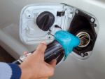 Hand Holding Fuel Pump Stock Photo