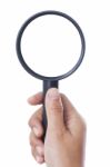 Hand Holding Magnifying Glass Stock Photo