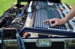 Sound Engineer At Mixing Desk Stock Photo