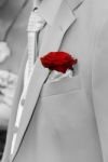 Red Rose In Pocket Of Suit Stock Photo