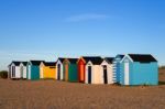 A Row Of Brightly Coloured Beach Huts In Southwold Stock Photo