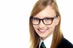 Closeup Shot Of Smiling Schoolgirl In Eyeglasses Stock Photo