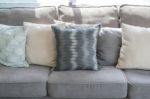 Pillows On Modern Grey Sofa In Living Room Stock Photo