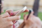 Beautiful Young Woman Using Her Mobile Phone In The Street Stock Photo