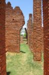 Ancient Way With Crack Brick Pole In History Park Stock Photo