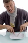 Male Posing With Fork And Knife Stock Photo