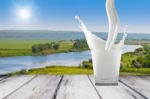 White Milk In Glass On The Table Stock Photo