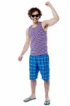 Excited Young Man Raising His Arm Stock Photo