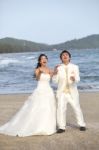 Groom And Bride Watching To Above And Acting Glad To See Somethi Stock Photo