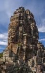 Ancient Stone Face Of Bayon Temple Stock Photo