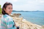 Young Woman Photography Near The Sea Stock Photo