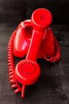 Retro Vintage Red Landline Unhang On Wooden Background Stock Photo