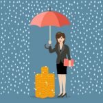 Business Woman With Umbrella Protecting Her Money From Financial Stock Photo