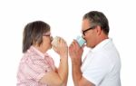 Aged Couple Drinking Coffee Stock Photo