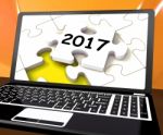 Two Thousand And Seventeen On Laptop Shows New Years Resolution Stock Photo