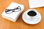 Specs On Book With Tea Cup Stock Photo