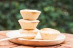 Mini Pies On Wooden Plate Stock Photo