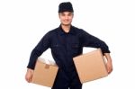 Young Courier Guy Holding Boxes Stock Photo