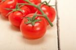 Fresh Cherry Tomatoes On A Cluster Stock Photo