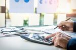 Business Finance Man Calculating Budget Numbers, Invoices And Fi Stock Photo