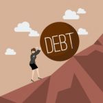 Business Woman Pushing Heavy Debt Uphill Stock Photo