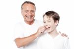 Playful Father And Son, Pinching Cheeks Stock Photo