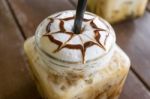 Iced Coffee Mocha On Table Wood Background In Cafe Stock Photo