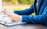 Handsome Businessman Wearing Suit And Using Modern Laptop Outdoo Stock Photo