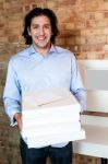 Smiling Caucasian Man Holding Pizza Boxes Stock Photo