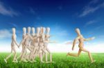 Wooden Man Running Ahead Stock Photo