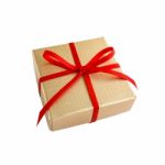 Golden Gift Box With Red Ribbon Stock Photo