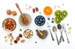 Ingredients For A Healthy Foods Background, Nuts, Honey, Berries Stock Photo