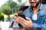 Modern Young Man With Mobile Phone In The Street Stock Photo