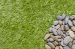 Stone On Grass Background Stock Photo