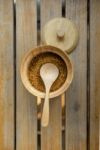 Wooden Spoon In Brown Sugar Bowl On Wood Table Stock Photo