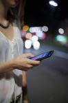 Woman Use Of Cellphone At Outdoor Stock Photo