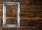 Old Silver Picture Frame On Wooden Background Stock Photo