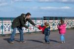 Cardiff Uk March 2014 - Family Playing On Penarth Pier Stock Photo