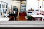 Selected Focus Empty Brown Wooden Table And Coffee Shop Or Resta Stock Photo