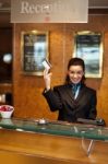 Receptionist Holding Cash Card Stock Photo