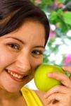 Young Lady About To Eat An Apple Stock Photo