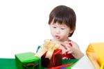 Adorable Little Girl With Present In Chirstmas Day Stock Photo