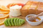 Honey Toast And Ice Cream With Mixed Fruit On Bread Stock Photo