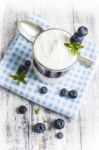 Light Breakfast Setup With Yogurt On White Wooden Table Stock Photo