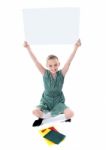 Smiling Girl Holding Whiteboard Stock Photo