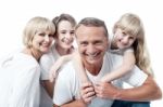 Cheerful Family Of Four Isolated On White Stock Photo